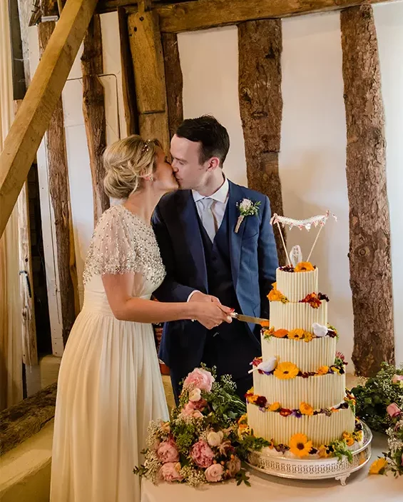 Clock Barn Bunting and calligraphy topped wedding cake